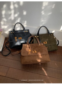 Detailed shot of retro crossbody bags in suede and leather finishes with metal locks