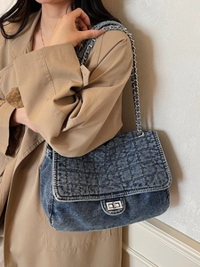 Retro denim quilted crossbody bag with silver chain strap and metal rotary buckle closure