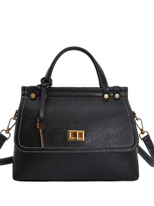 Classic black leather vintage handbag with contrast stitching and golden turn-lock