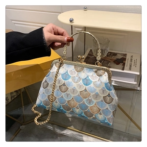 Detailed macro view of retro embroidery brocade texture on classic vintage handbag