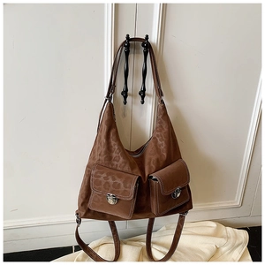 Detailed view of brown leopard print tote with front flap pockets and white stitching