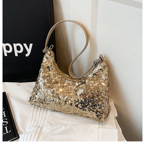 Detailed view of the sparkling gold sequin hobo bag with metallic texture handle