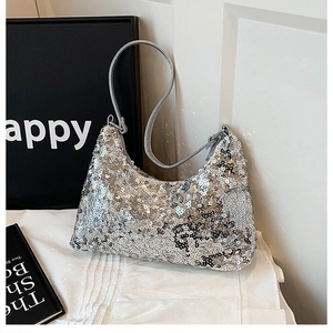 Close-up of the silver sequins on the crescent shoulder bag with high-quality texture