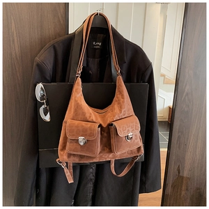 Close-up of brown leopard print hobo bag with front pockets and silver metal buckles