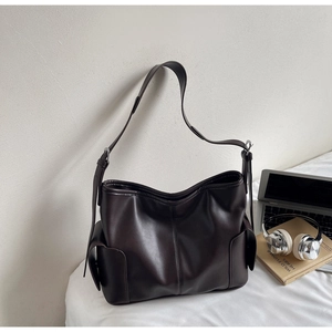 Detail view of large dark brown PU leather tote bag with adjustable shoulder strap