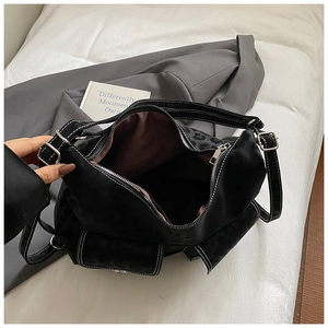 Spacious interior of black leopard patterned tote bag with white stitching and brown lining