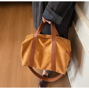 Detail of vintage mustard suede tote bag showing large capacity and rich leather texture