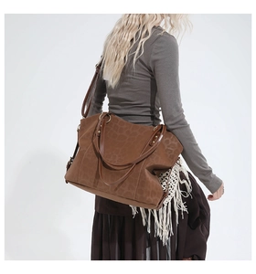 Brown leopard print tote bag with leather handles shown on a model for a chic daily look