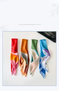 Detail view of four silk-like scarves featuring geometric oil painting patterns on a white bag
