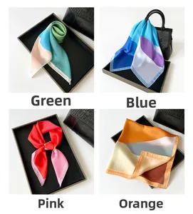 Detail view of colorful silk square scarves with oil painting style and rolled edges