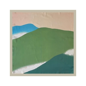 Detailed top view of abstract landscape pattern on silk square scarf with green and blue tones