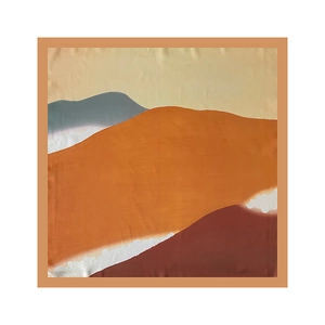 Close-up of artistic abstract oil painting silk scarf with warm orange and yellow tones