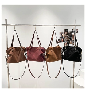 Detail of four color options for large suede leopard print tote bag with gold ring hardware