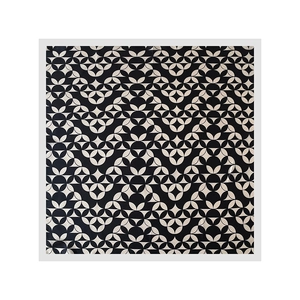 Detail of elegant square scarf featuring vintage geometric patterns and silky texture fabric