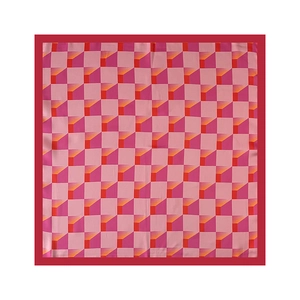 Close-up of vibrant pink and red geometric pattern silk square scarf with red border