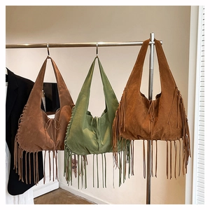 Suede fringe tote bags in dark brown, olive, and camel with woven details and tassels