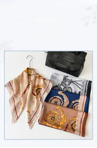 Detailed view of four elegant silk scarves with baroque chain patterns on a handbag