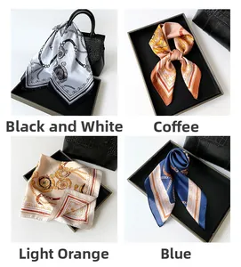 Detail view of four silk scarves with chain prints on elegant handbags and display trays