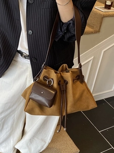 Retro tan faux suede bucket bag with drawstring closure and matching small coin purse