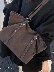 Versatile dark brown leather tote bag for women featuring large capacity and silver hardware
