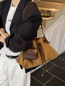 Minimalist large capacity drawstring bucket bag in ginger brown suede with small pouch