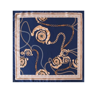 Detailed pattern of a square silk scarf with golden chains and baroque belt motifs