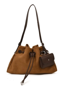 Vintage mustard suede tote bag with drawstring closure and brown leather strap