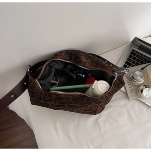 Interior view of leopard print suede shoulder bag showing large capacity for essentials