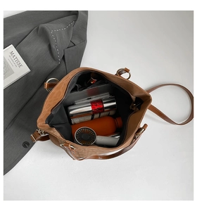 Interior view showing large capacity storage for laptop and daily items in the leopard tote bag