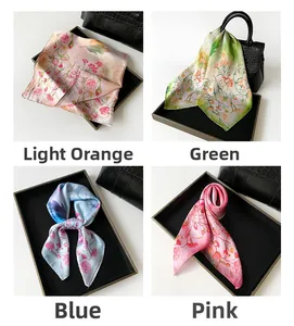 Detailed view of four colorful rose print silk scarves with soft satin finish luster