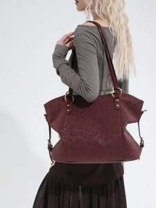 Large burgundy leopard print tote bag with gold ring hardware and dual handles