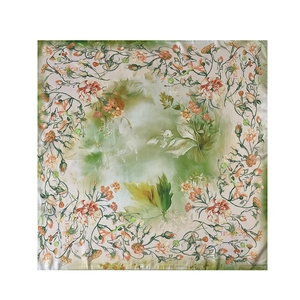Detail view of square silk scarf with floral rose print and artistic watercolor dye effect