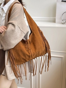 Vintage brown suede tote bag with long tassels and bohemian style shoulder strap