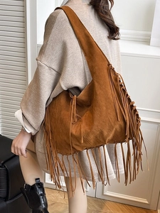 Retro tan suede tote bag with long tassels featuring large capacity crescent hobo design