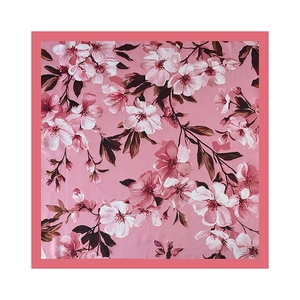 Detail of satin floral scarf showing realistic pink magnolia pattern and silk texture