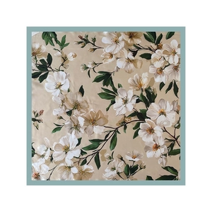 Elegant magnolia floral print square satin scarf in champagne with green leaves