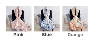 Trois élégantes longues écharpes en satin imprimé aux motifs floraux rose, bleu et orange