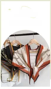 Detail of silk-texture triangle scarf featuring equestrian leather belt and chain prints
