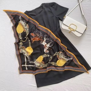 Elegant horse carriage print silk scarf paired with a minimalist black short sleeve dress