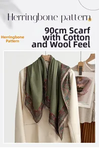 Detailed view of herringbone 90 square scarf with paisley border on white suit