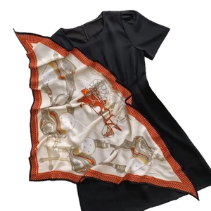 Elegant black short sleeve dress paired with horse print silk scarf accessory