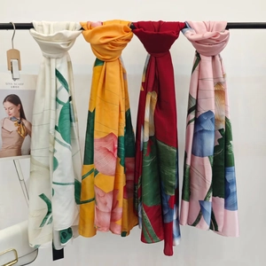 Silk-textured long floral scarves in four colors featuring realistic lotus print patterns