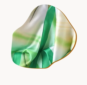 Detailed macro view of high-quality silk scarf with green and beige gradient abstract stripes
