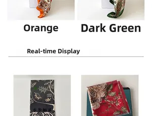 Detail showing various 90x90cm satin silk scarves with classic paisley and floral patterns