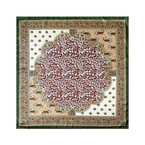 Detailed close-up of classic paisley and floral pattern on green satin square scarf