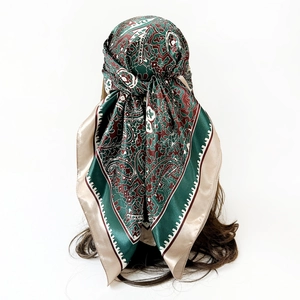 Back view of model wearing a 90cm paisley silk satin square scarf as a headscarf