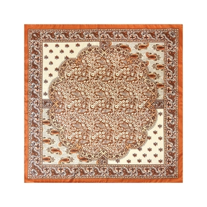 Detailed flat lay of a satin square scarf featuring orange paisley patterns and floral emblems
