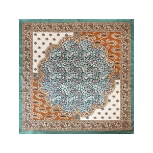 Detailed macro view of the vintage paisley pattern on a silky 90cm square scarf