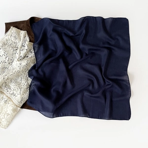 Navy blue square hijab scarf in premium chiffon fabric on white minimalist background