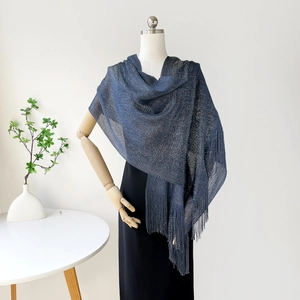 Detail of navy blue shawl with gold metallic shimmer and matching long fringe trim